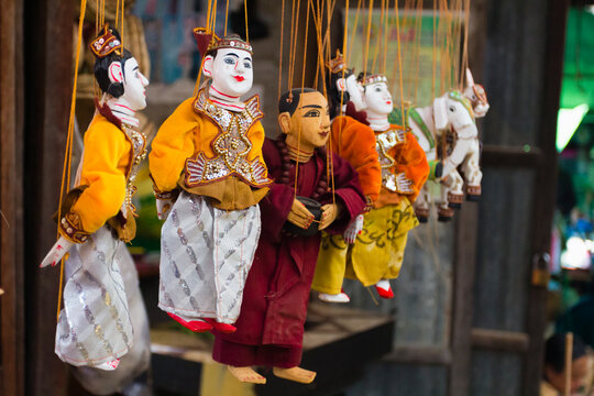 Close-up of Burmese puppet (Yoke the) (marionettes) hanging from strings on market, Nyaungshwe, Lake Inle, Shan State, Myanmar