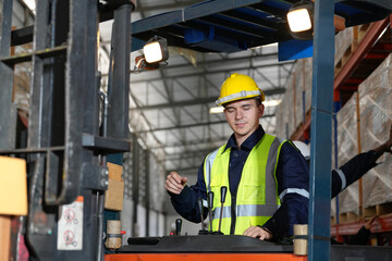 Man forklift driver working in a warehouse.