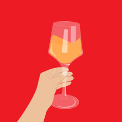 Female hand holding a glass with white wine.