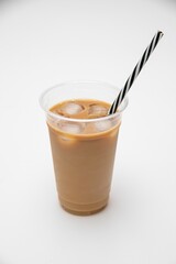 Vertical shot of an iced coffee in a plastic takeaway cup