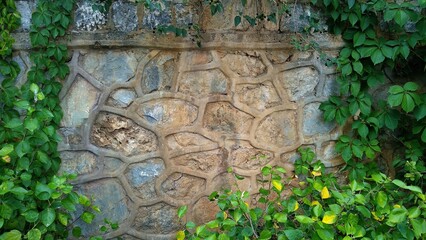 leaves and brick fence wall copy space mock up