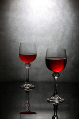 Still life with glasses with red liquid