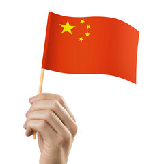 Hand holding flag of China, cut out