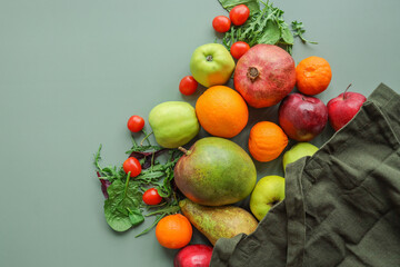 Eco bag with products on color background