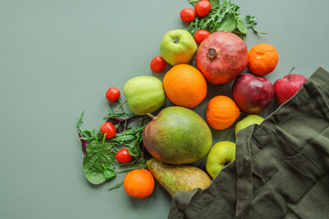 Eco bag with products on color background