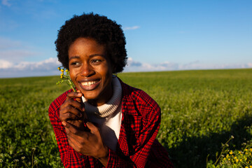 African girl in green meadow