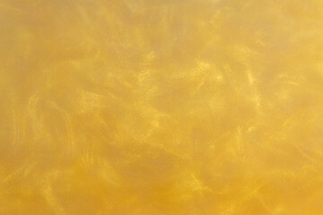 Yellow Golden Shiny Abstract Background. Paints, Acrylic, Glitter in Water. Yellow Golden Shiny Liquid Surface, Ripples, Waves.