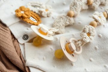 Fototapeta na wymiar Baby accessories for newborns, handmade