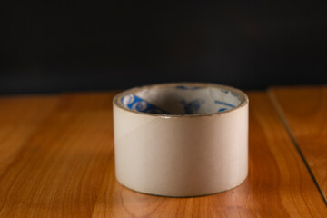 Masking tape on wooden background 