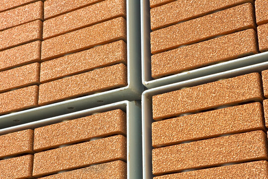 New performing modern exposed brick wall made with blocks with surface layer called ventilated wall system to improve thermal performance and properties