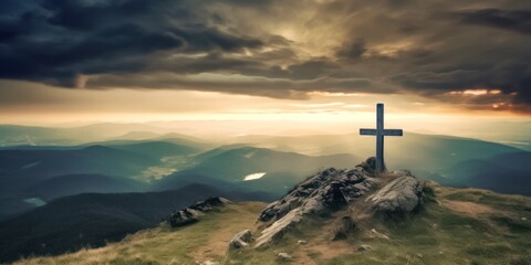 Fototapeta premium A Cross Silhouetted Against a Colorful Mountain Sunset