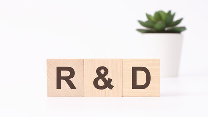 r and d text on wooden cubes. white background. business concept