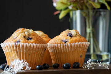 Blue berry muffins with flower background
