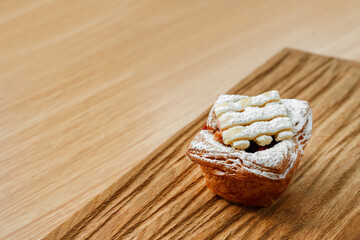 Pastry made of puff pastry with powdered sugar