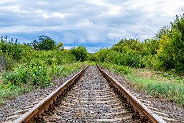 Fototapeta na wymiar Photography to theme railway track after passing train on railroad