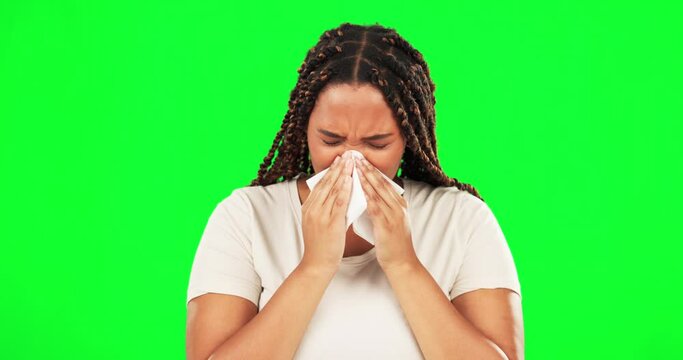 Black woman, blowing nose and sick on studio green screen with flu virus, cold and health crisis in isolated mockup background. Ill, sneeze and tissue for person with sinusitis problem and allergies