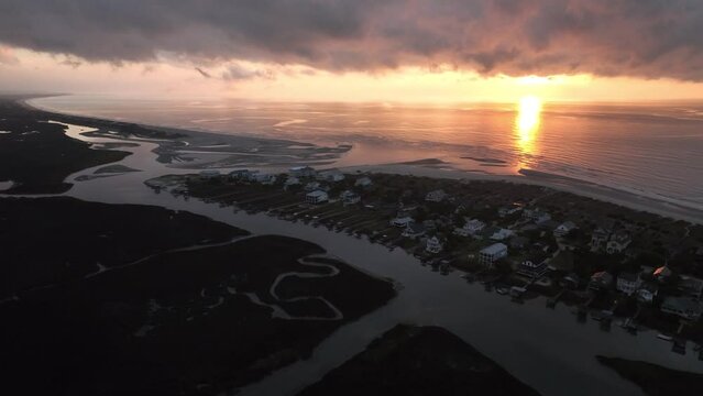  Vacation along South Carolina shoreline with sunrise over beach front property at North end of Pawleys Island