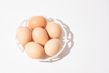 Eggs in bowl on white background, Easter eggs. Protein food