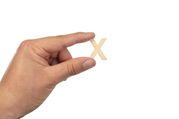 Unrecognizable person holding a letter x on a white background