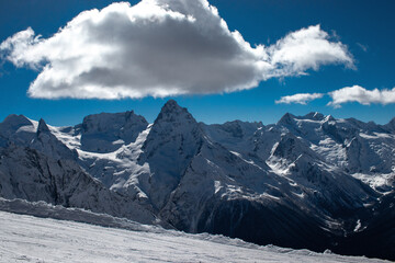 Fototapeta na wymiar Snow-covered peaks of the Caucasus mountains