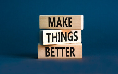 Make things better symbol. Concept words Make things better on wooden block on a beautiful grey table grey background. Business and make things better concept. Copy space.