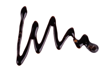 Chocolate syrup drizzle isolated on white background. Splashes of sweet chocolate sauce. Top view.