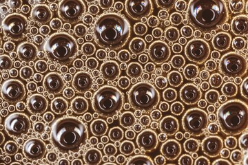 Macro abstract shot of a background of air bubbles in a tea