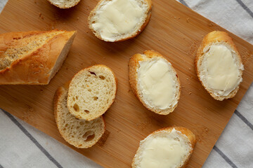 Homemade Bread and Butter on a bamboo board, top view. Flat lay, overhead, from above.