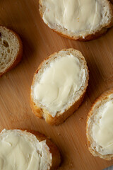 Homemade Bread and Butter on a bamboo board, top view. Flat lay, overhead, from above.