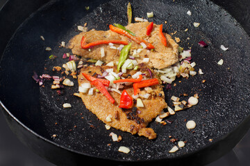 Pork cutlets cooked on a traditional Argentinean 