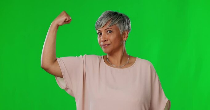 Face, green screen and senior woman flex arm, power and confident against a studio background. Portrait, mature female flexing and person with empowerment, muscle and success with motivation or fight