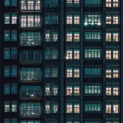 Building windows at night time. Generative AI.
