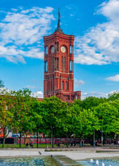 Red Town Hall (Rotes Rathaus) and fountains on Alexanderplatz square, Berlin, Germany