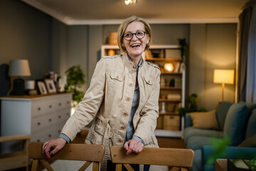 Portrait of one mature blonde caucasian woman with eyeglasses at home