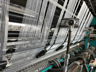 Industrial knitting machine for knitting textile fabrics