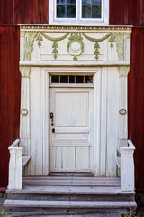 Entrance of traditional timber house in Sweden