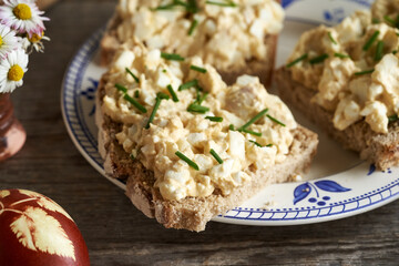 Bread spread made of Easter eggs in spring on slices of sourdough bread