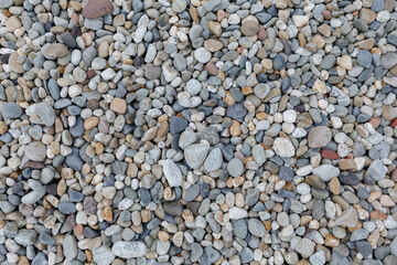 Pebbles background. Small pebbles on the beach.