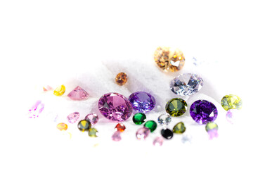 colorful diamonds on turning Showcase with snowing background..Precious stones and gems, jewelry. rhinestone and brilliant, .sapphire and amethyst, aquamarine and tourmaline, diamond and emerald..