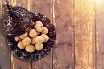 Tasty healthy nuts in bowl on the desk