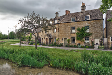 Fototapeta na wymiar Cottages with Eye River in Lower Slaughter, Cotswolds, UK