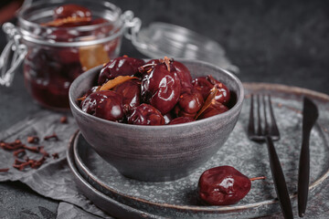 Bowl of pickled plums with spices