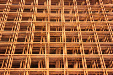 Rusty steel rebar grids, abstract construction backround