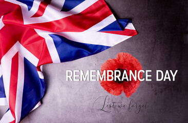 Fototapeta na wymiar Remembrance Day in the United Kingdom. Banner template with official Great Britain Flag and Poppy flower.
