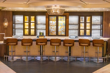 Generic concept of a night bar that serves alcoholic drinks and cocktails ona cruise ship vacation.