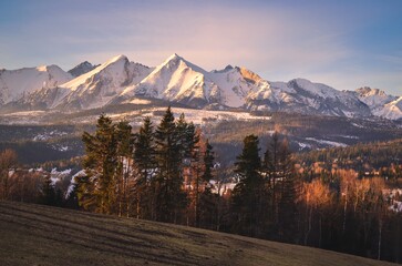 Charming panorama of the Polish Tatra Mountains in the morning. View of the Belianske Tatras from the village of Lapszanka, Poland.