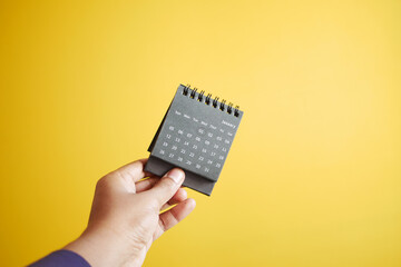 POV shot of holding a calendar 