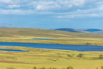 Fototapeta na wymiar Landscape of the tundra with a lake in the Finnmark province of Norway