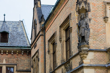 Ancient sculptures in the architecture of the city. Historical and cultural heritage. Background.