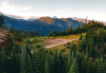 Aerial shot of shot of a pickup truck in front of Cascade mountains in Washington state. A perfect...